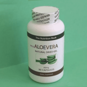 Aloe vera capsules bottle on green background.