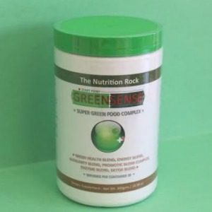 Green food powder in a container.