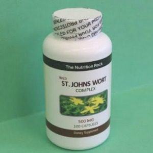 St. John's Wort supplement bottle on green background.