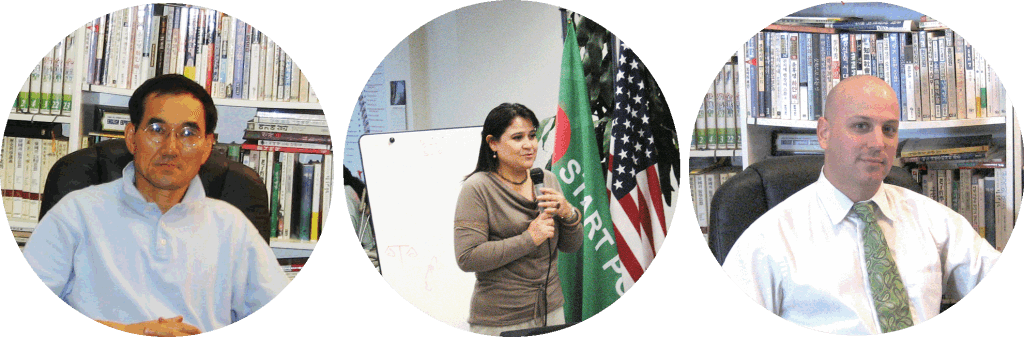 A woman standing in front of an american flag.