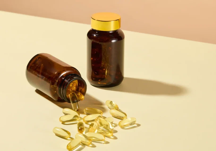 A table with two bottles and some pills on it