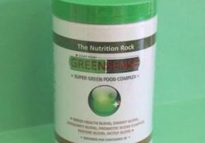 Green food powder in a container.