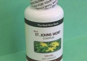 St. John's Wort supplement bottle on green background.