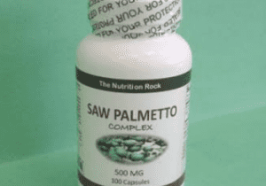 Saw Palmetto Complex supplement bottle on green background.